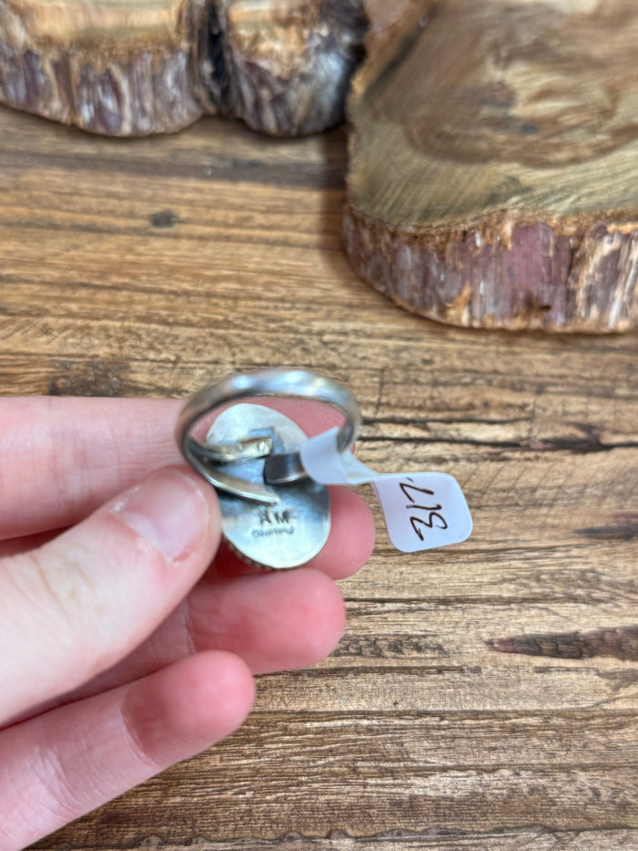 Adjustable sterling silver ring underside with stamped maker mark