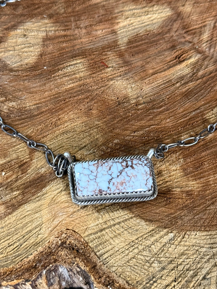 Sterling silver necklace with rectangular wild horse pendant and rope-style chain detail