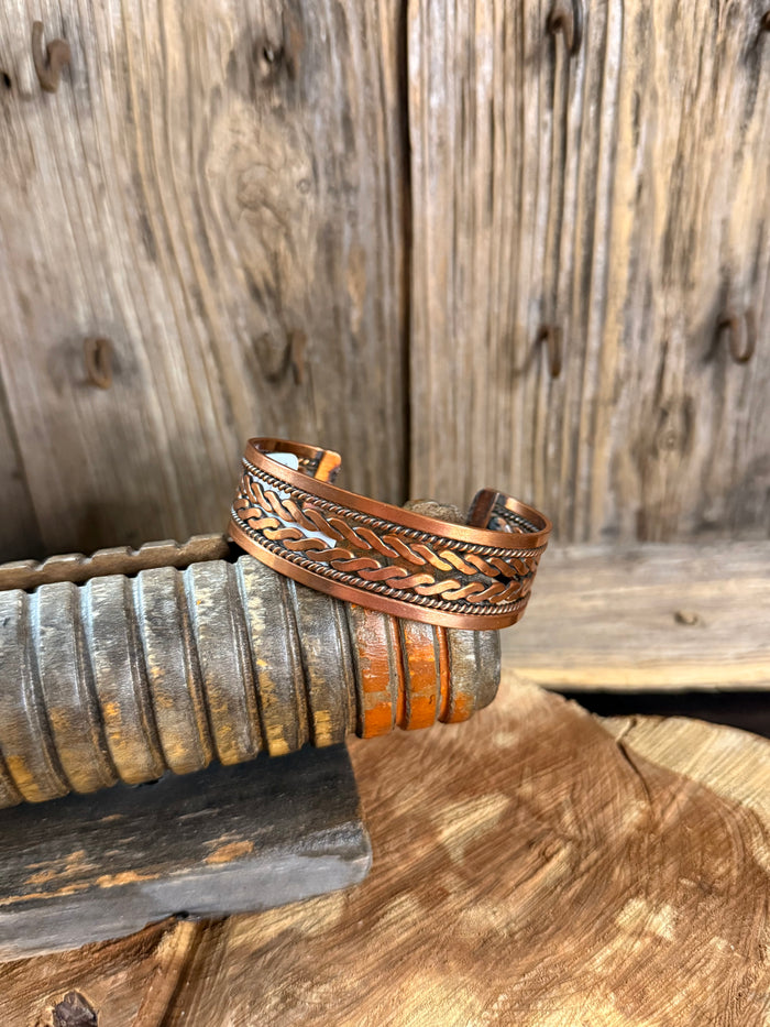 Woven copper cuff bracelet with braided edge detailing