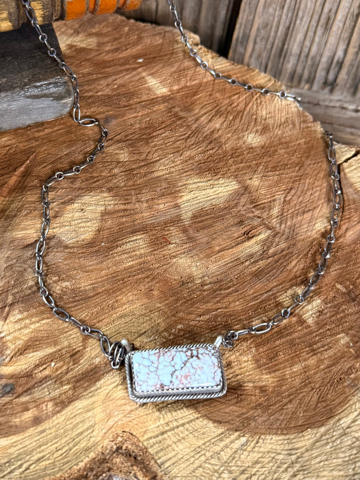 Sterling silver chain necklace with rectangular wild horse stone pendant, close-up