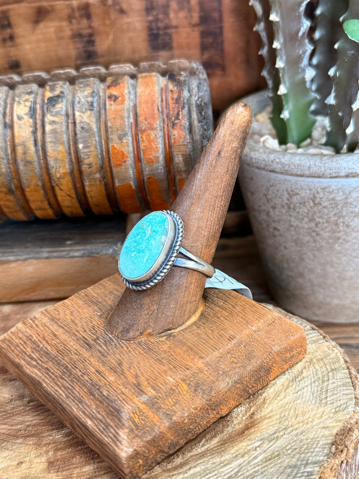 Adjustable sterling silver ring with oval turquoise stone and tapered shoulders
