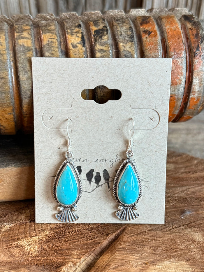 Pair of turquoise teardrop fan fishhook earrings with silver-tone frames.