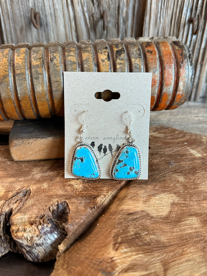 Sterling silver fishhook earrings with bright turquoise teardrop stones