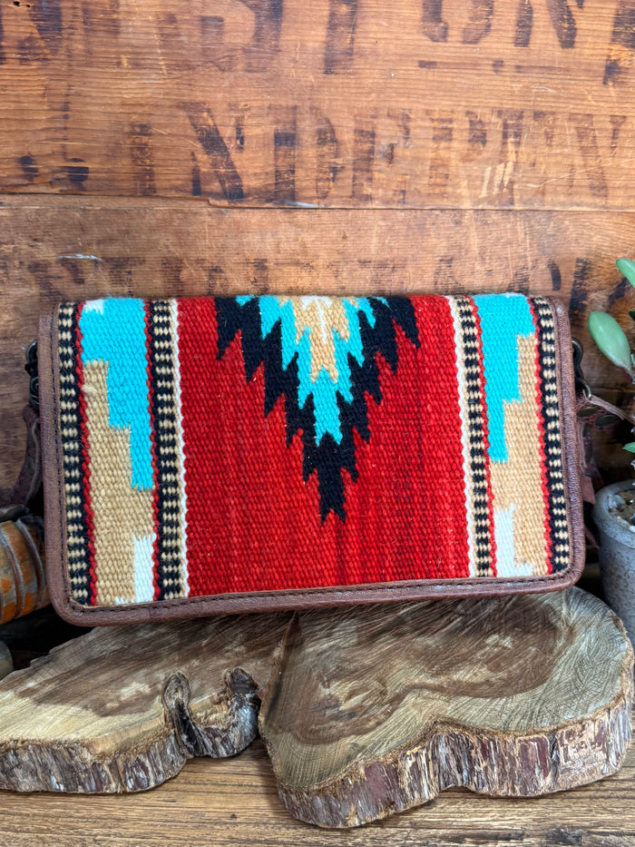 Woven crossbody wristlet wallet with red, blue, and white zigzag stripe pattern