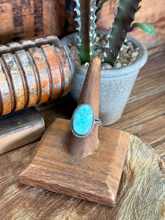 Adjustable sterling silver ring with oval turquoise cabochon stone