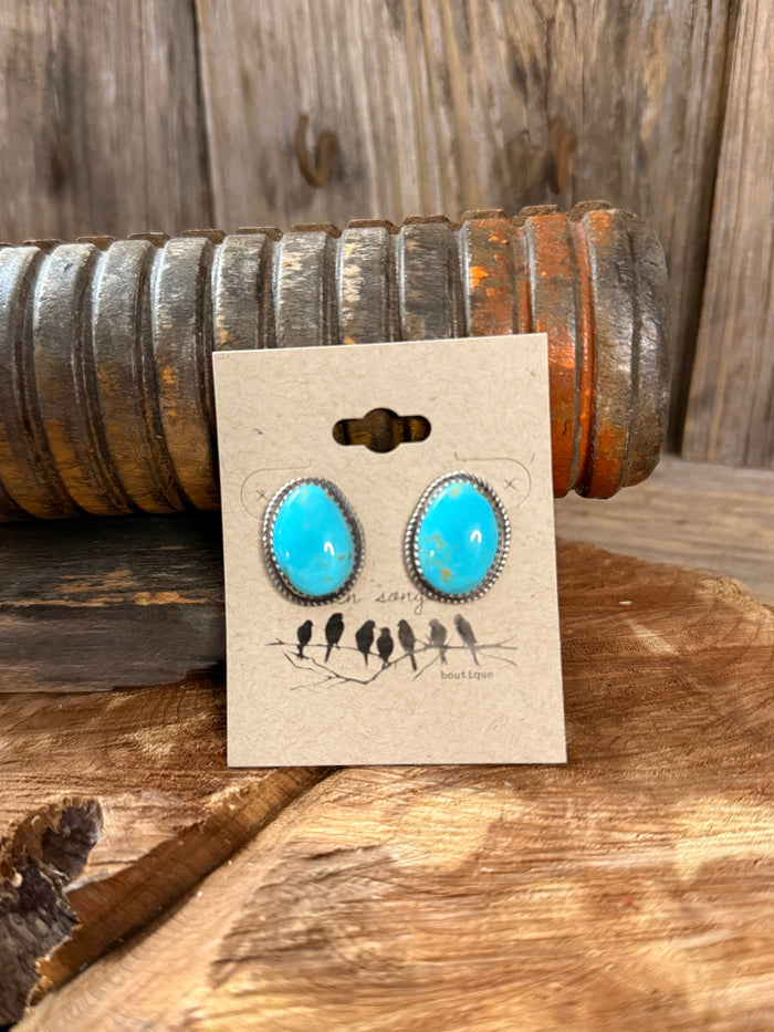Turquoise teardrop stud earrings with silver-tone beaded bezel