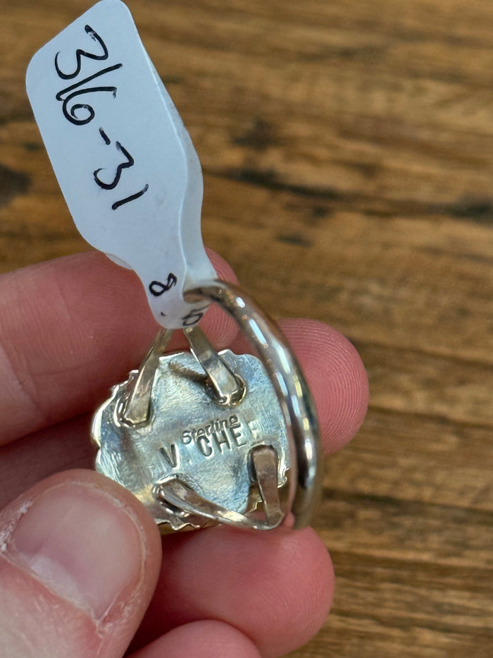 Sterling silver ring back with open oval frame and small engraved markings