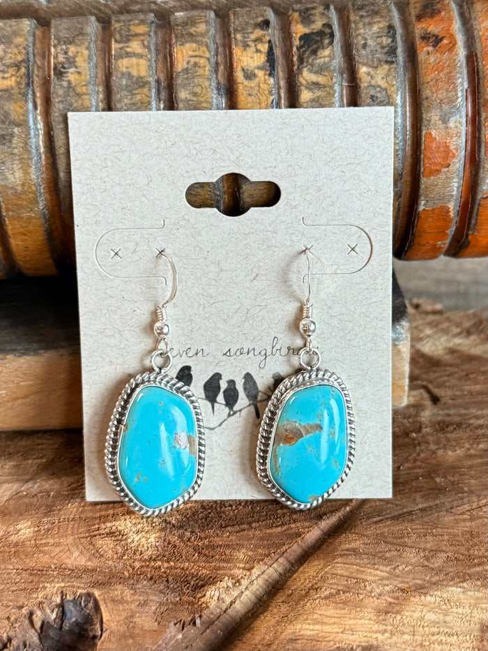 Turquoise drop fishhook earrings in sterling silver with textured scalloped border
