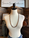 Copper bead necklace on mannequin bust