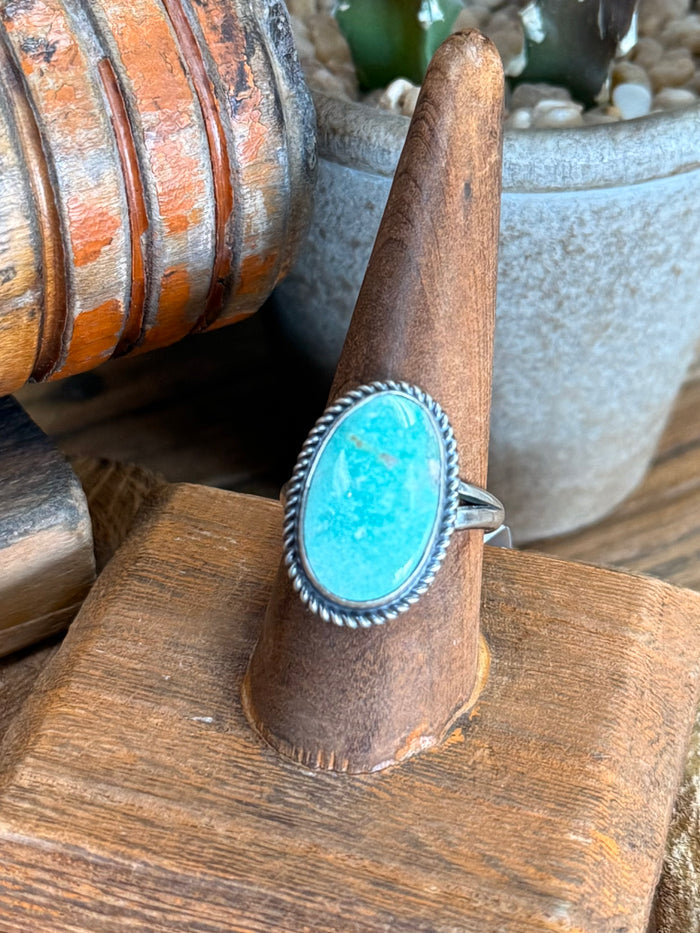 Sterling silver adjustable ring with large oval turquoise cabochon and beaded edge