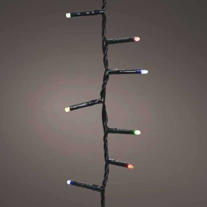 The Compact Twinkle LED 500 ct. String Light Set Multi-Color features vibrant red, green, blue, and white bulbs on a black wire, perfect for adding a festive touch to any space. Available for Pickup & Delivery.