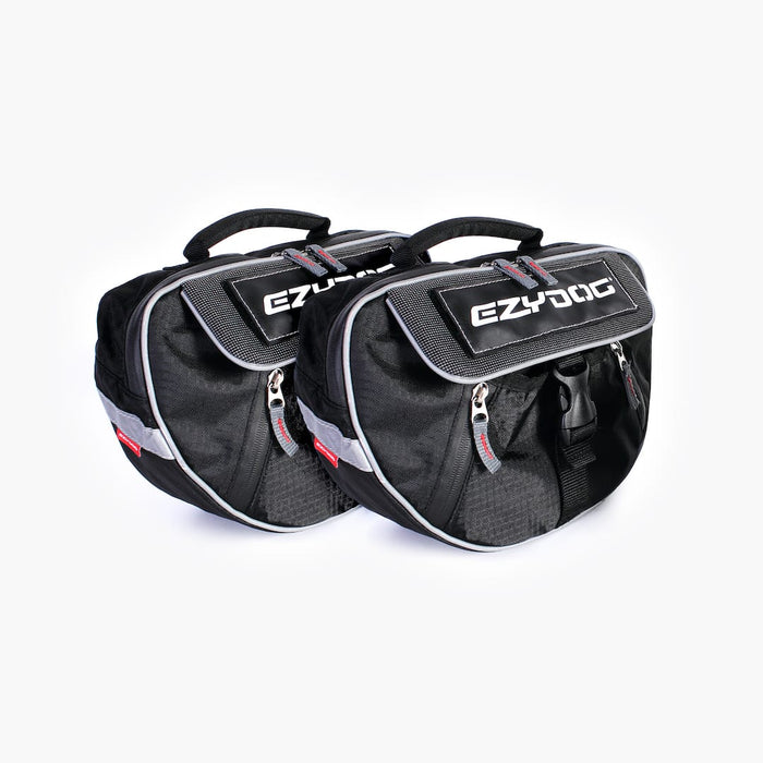 A black dog backpack with the EzyDog brand logo, featuring a large main compartment and a quick-access front section, with reflective trim for safety.