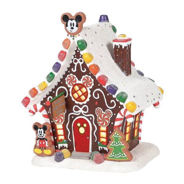 Department 56s Mickey’s Gingerbread House is adorned with snow-like frosting, colorful candy, and Mickey Mouse accents. Figures are on the roof and near the door, with a frosted green Christmas tree out front—a perfect standout for festive décor. Available for pick-up & delivery.