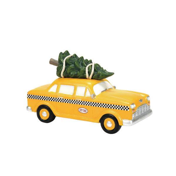 The Department 56 – Hailing Christmas Cab figurine, by Available for Pick-up & Delivery, features a charming yellow taxi with black-and-white checkered details and a green Christmas tree secured by white rope—ideal for your holiday display or festive décor.
