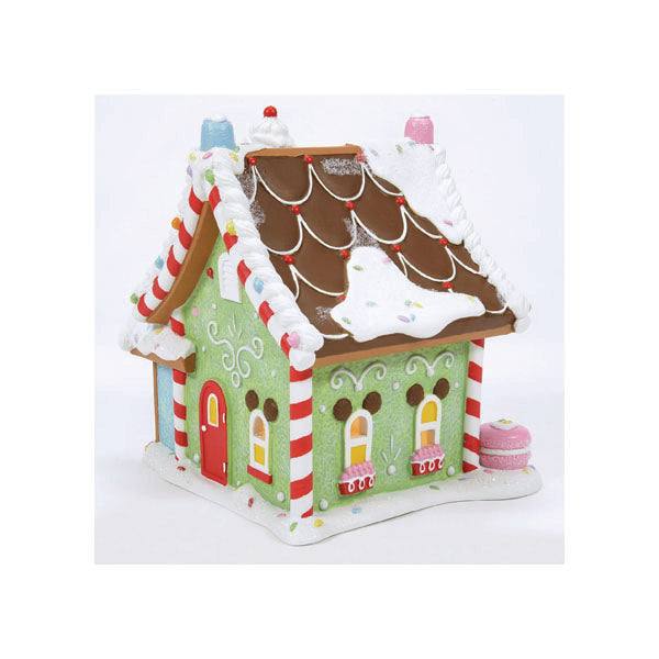 The Department 56 – Mickey’s Peppermint Villa features green walls, a brown roof with white icing, red and white candy cane pillars, colorful icing decorations, and a small pink circular candy structure. Its an ideal festive holiday décor with peppermint twist accents. Available for Pick-Up & Delivery.