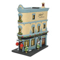 A Department 56 miniature model of a two-story building from the Christmas in the City Village, The Manhattan, features Maurys Steakhouse and The Manhattan Bar signs. Decorated with festive garlands, it includes detailed windows, doors, wreaths, and planters. Available for Pick-Up & Delivery.