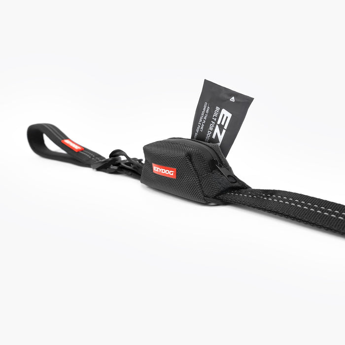A black EzyDog Essential poop Bag Holder attached to an EzyDog leash showing seabless integrated attachment and poop bag access