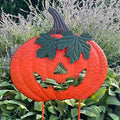 Deep orange pumpkin garden stake 34 inches tall.