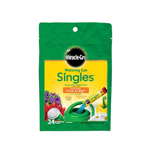 A green and yellow pouch of Miracle-Gro® - Watering Can Singles® by Pickup & Local Delivery Only, with colorful flowers and a watering can. Contains 24 packets (1.87 oz/53g) of plant food for bigger, healthier growth.
