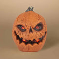 The Pumpkin - Talking Jack-o-Lantern by Available for Pick-up & Delivery is the perfect Halloween decoration, featuring an evil grin, glowing eyes and mouth. Its textured surface enhances its charm, and a hidden motion sensor activates speech against a plain background.