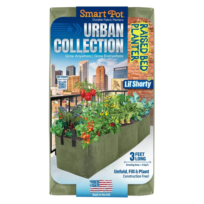 Front of a Smart Pot® Lil’ Shorty Planter (3ft), an aerated fabric raised bed from Pickup & Local Delivery Only, filled with vegetables on a balcony against a city skyline. Highlights small space gardening features.