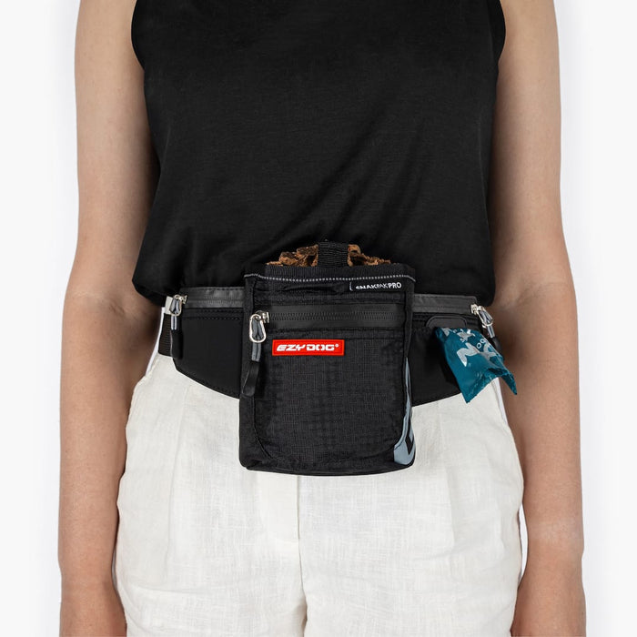Person wearing a black waist bag with visible branding on a white background