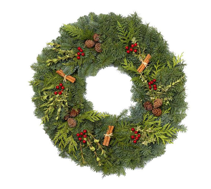 Experience holiday bliss with the Wreath - Cinnamon Stick from Available for Pick-up & Delivery, as it enchants your home with festive charm. Made from evergreen branches, its adorned with red berries and pine cones in a classic circular pattern.